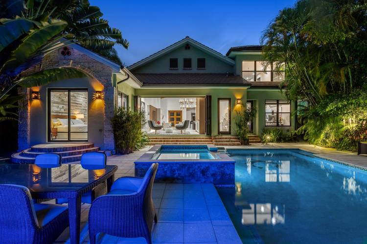 Behind a private gated entry, this stunning 2019 custom built residence blends modern design with tropical privacy in Victoria Park.