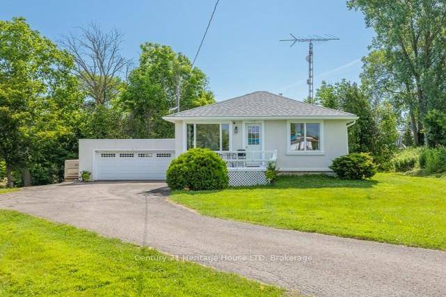 Discover the charm and comfort of this well maintained raised bungalow, set on an elevated and picturesque 0.