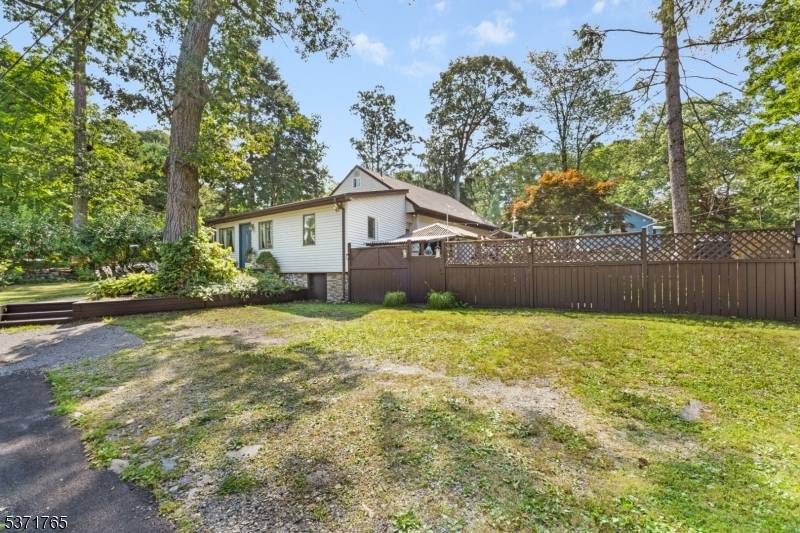 VACATION AT HOME ! MUST SEE 3 BEDROOM HOME ON A LARGE CORNER PROPERTY WITH ONLY A SHORT WALK TO UPPER GREENWOOD LAKE.