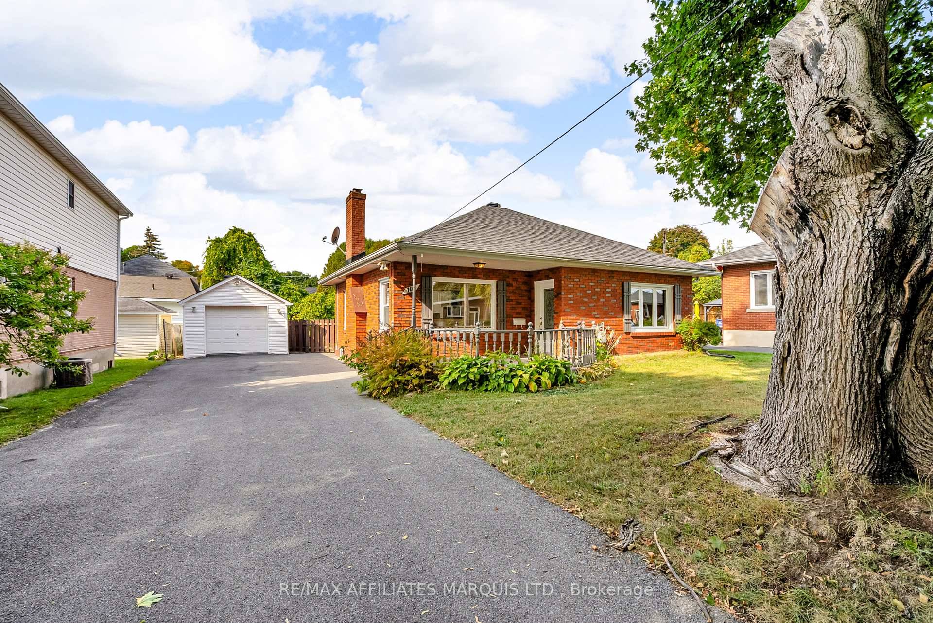 This charming brick bungalow offers an inviting blend of comfort and convenience in a desirable location.