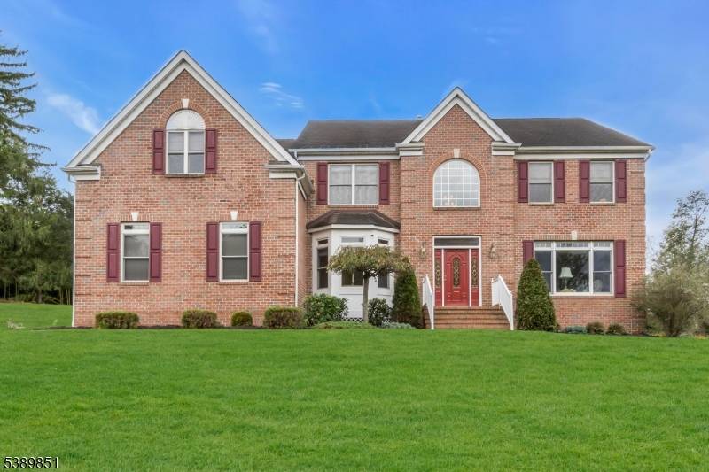 Elegant Center Hall Colonial on a Distinguished Corner Lot !