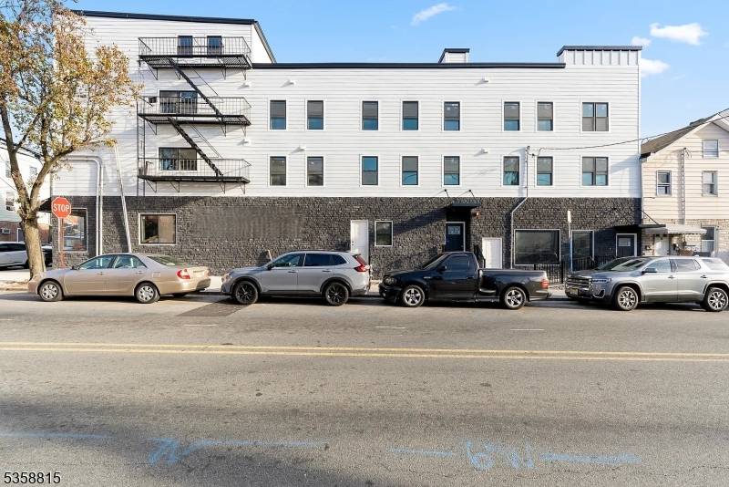 Discover this exceptional income producing commercial property situated prominently at the corner of Elm Street and Pacific Street in the heart of the vibrant Ironbound section of Newark.