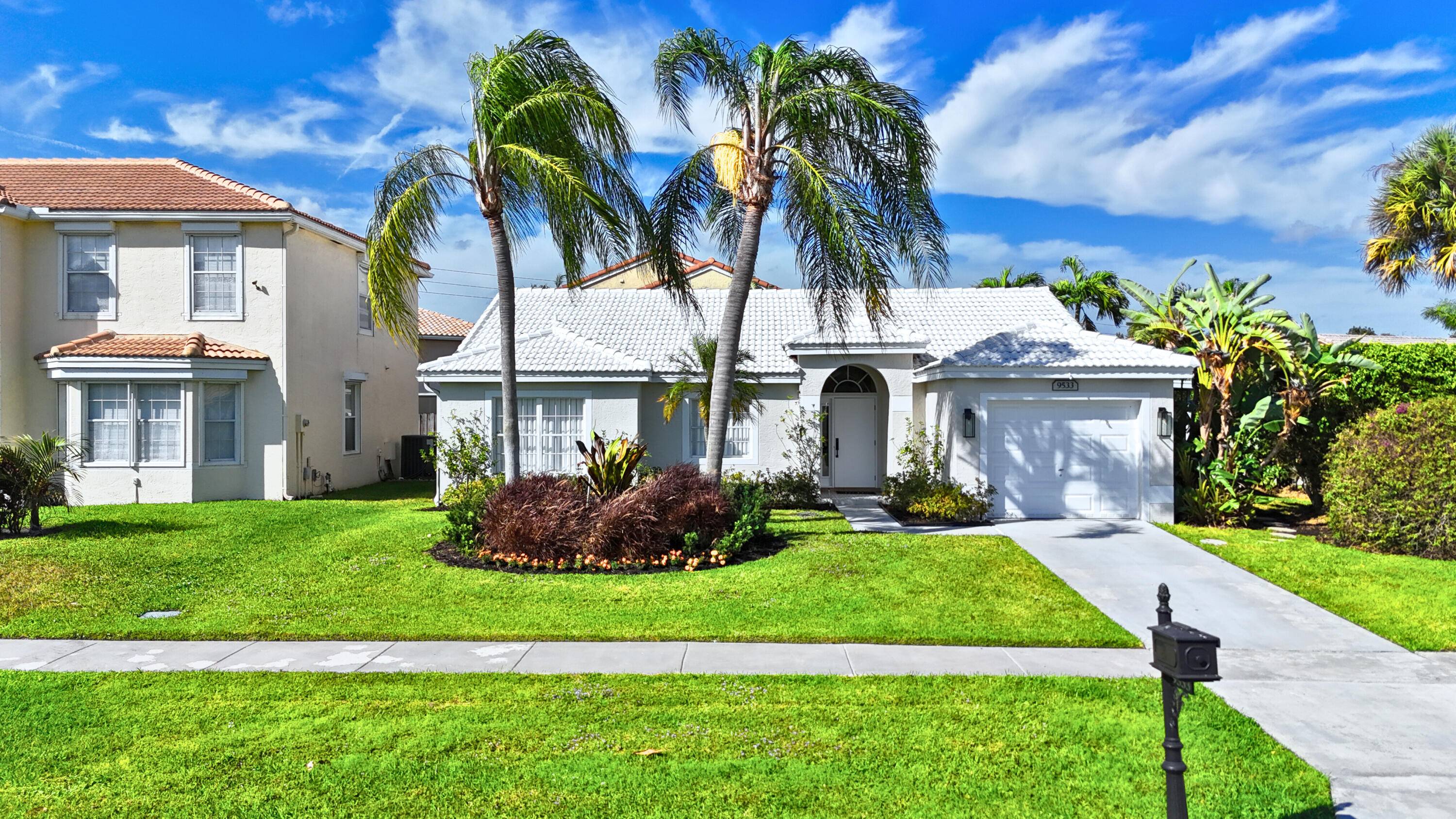 Welcome to 9533 Islamorada Terrace, a beautifully designed 3 bedroom, 2 bathroom home with a garage in the sought after Boca Landings community.