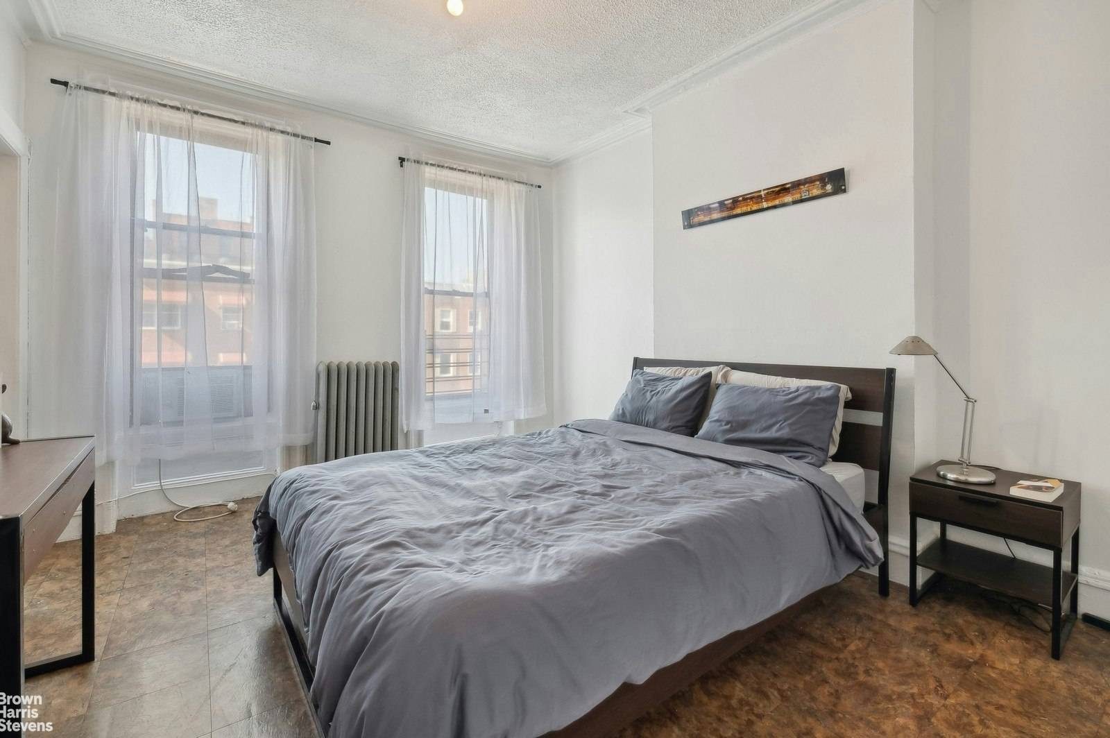 This exceptional townhouse in the heart of Mott Haven is a true gem.