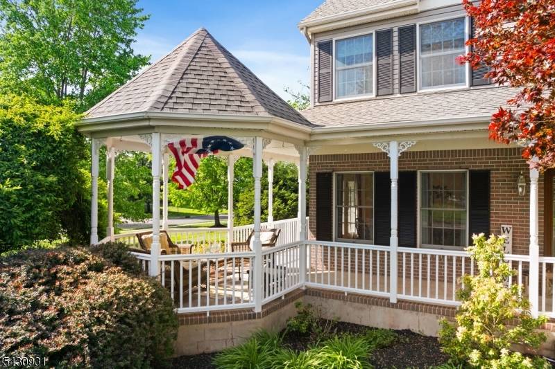 FALL IN LOVE with this enamoring Victorian style home, showcasing a delightful wrap around front porch roomy Gazebo, tucked away on a cul de sac in the distinct Country Classics ...