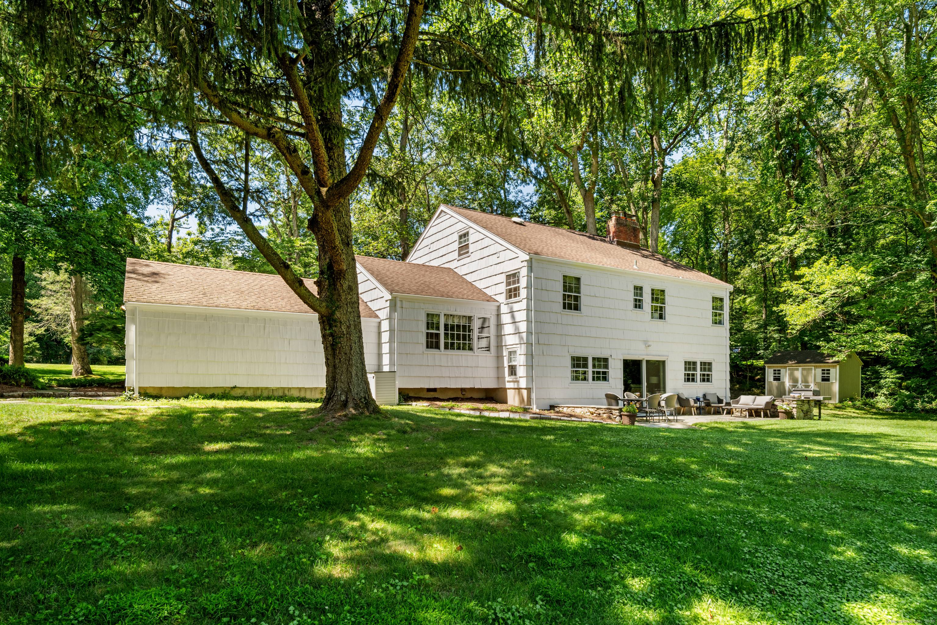 Colonial Split Level in the highly sought after Sawmill Association of North Stamford, ideally situated on a picturesque, level acre with serene pond views.