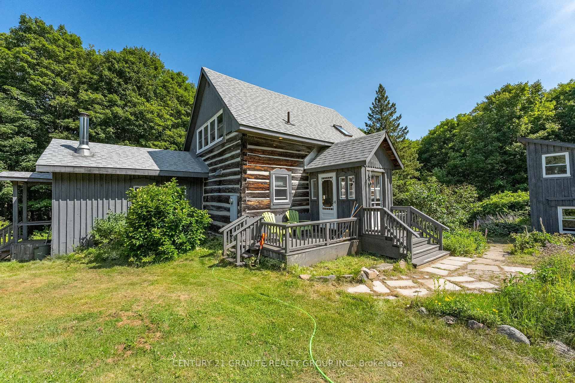 Nestled in the heart of the scenic Monteagle Hills you will find this unique 5 ACRE property which features a classic log home, originally built in the 1970s, that has ...