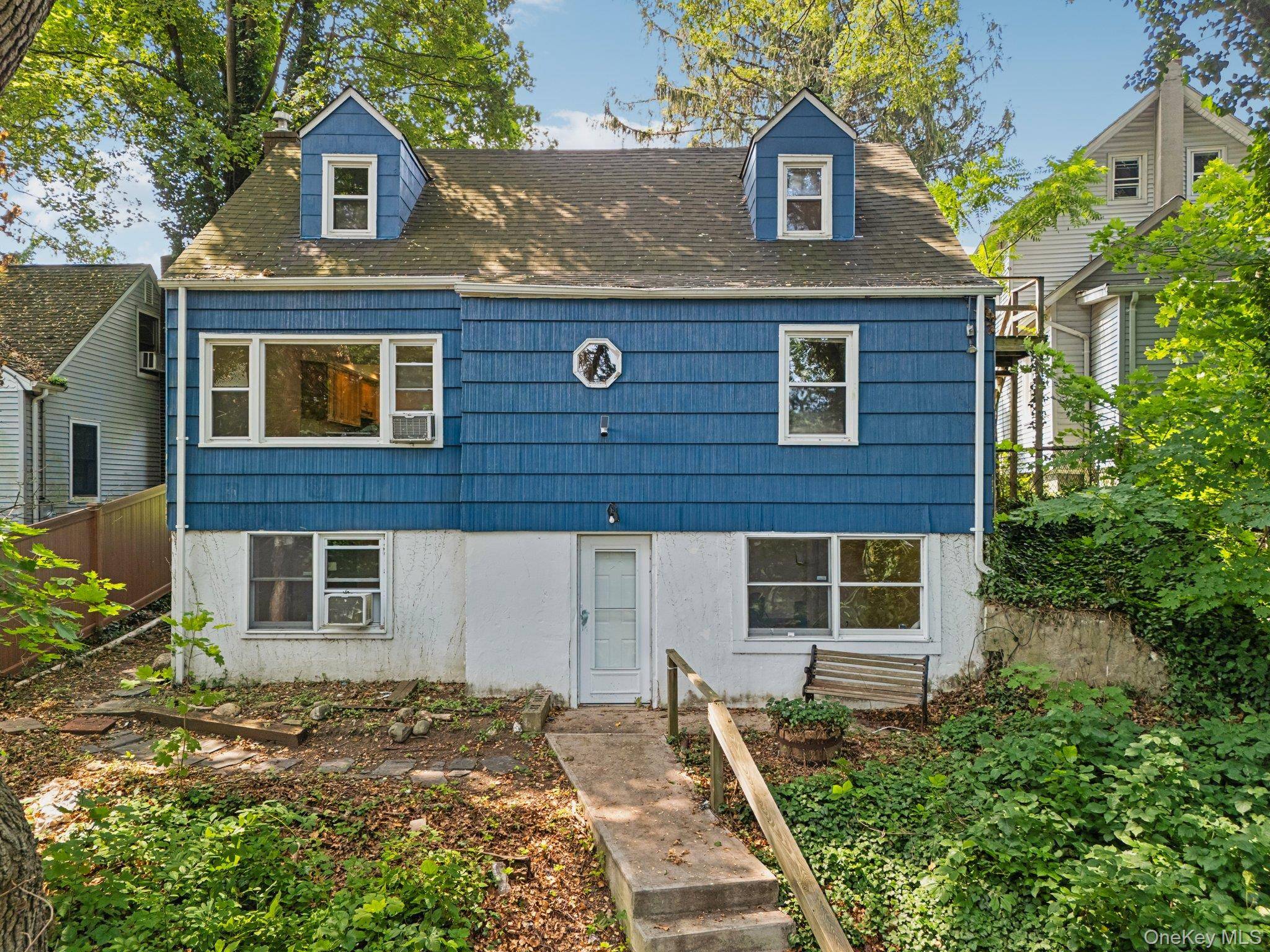 This adorable Cape Cod style home, nestled into the hillside of this serene tree lined street in a coveted neighborhood of East Northport provides ample living space across three fully ...