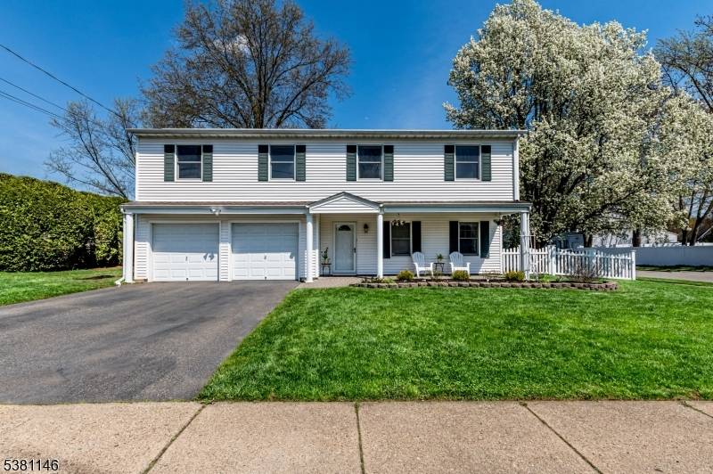 This wonderful four bedroom, two and a half bathroom home is nestled on a beautiful corner lot in the highly desirable Cloverhill community.