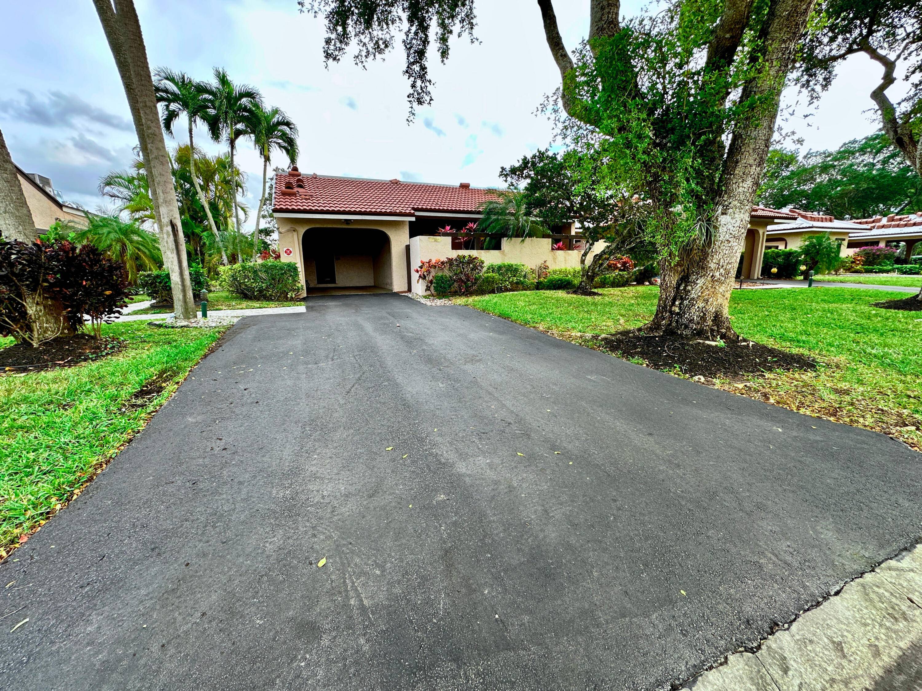 NEW ROOF ! Welcome to your dream home in the prestigious Boca Lago community of Boca Raton !