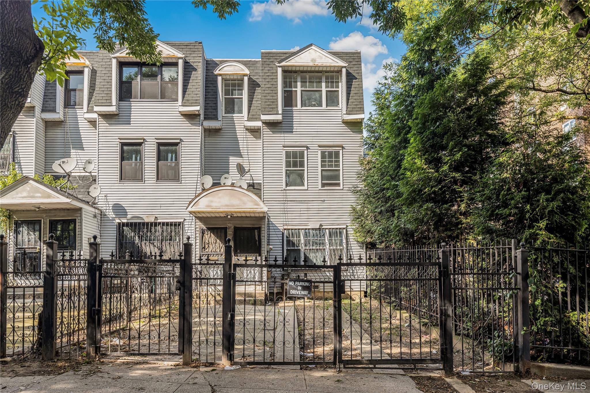 Immaculate 2 Family brick home built in 1992 located in the Heart of Crotona Park East.