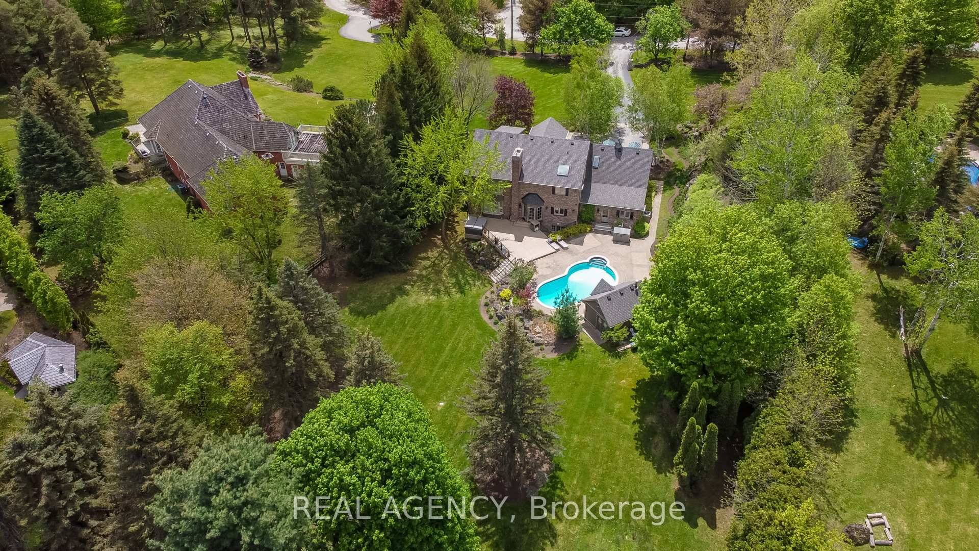 Gated Luxury Estate in Burlington Private, Secure, Minutes from Downtown, Welcome to a spectacular custom built Branthaven estate set on 1.