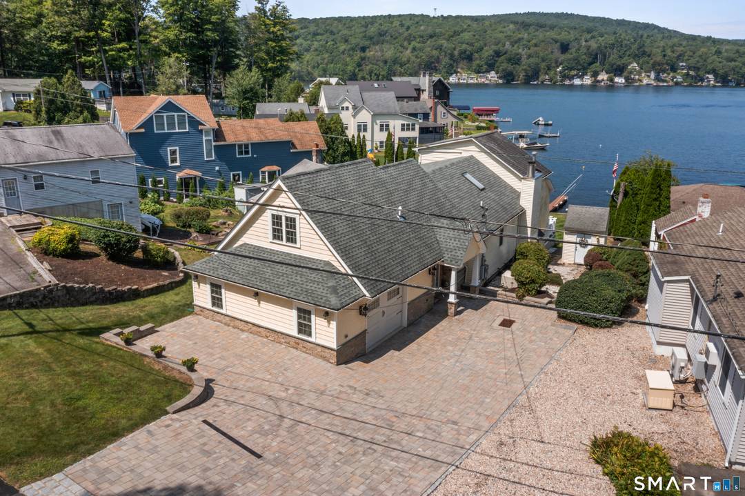 Experience the best of year round waterfront living on Highland Lake in this beautifully maintained 3 bedroom, 3 bath home with stunning panoramic views and direct water access.