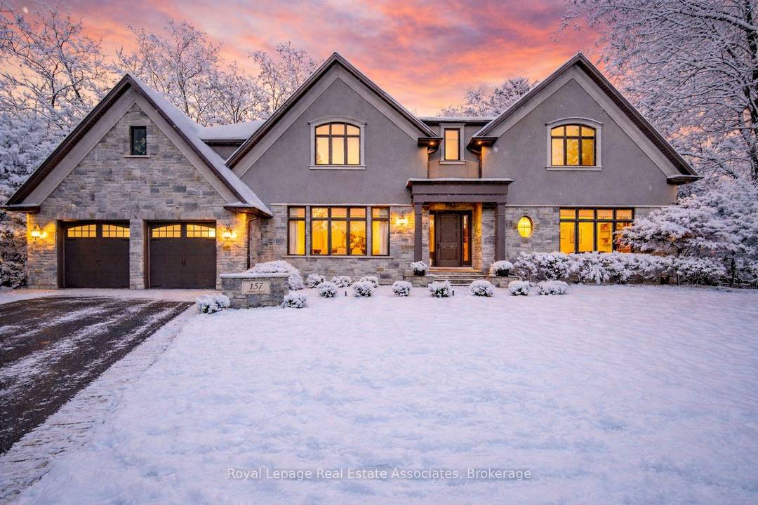 Experience refined family living at its gold standard at 157 Dianne Avenue, an expansive pie shaped lot that offers rare, year round privacy.