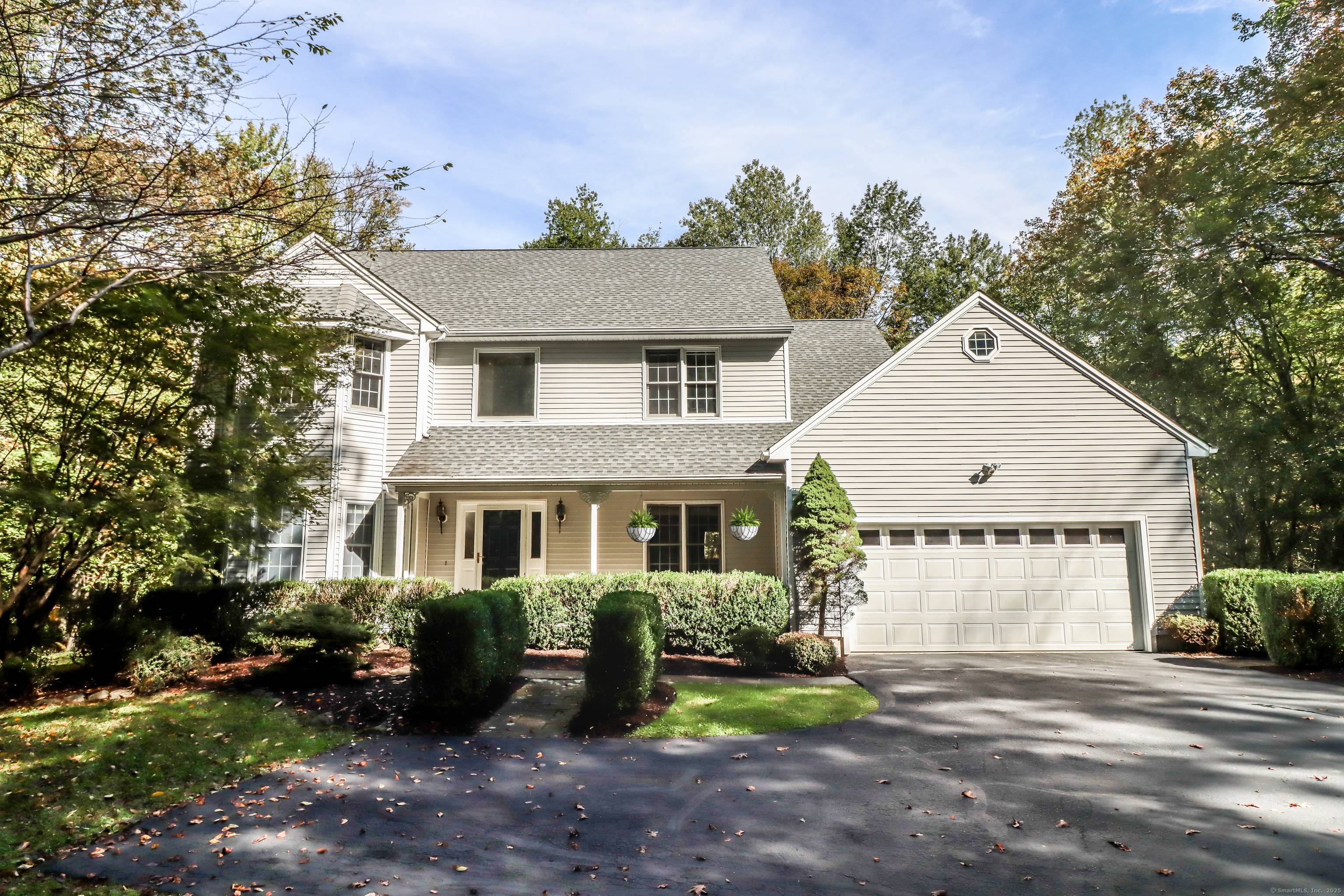 Set on 8 private, wooded acres in one of Brookfield's most coveted neighborhoods, this refined Colonial offers a perfect blend of timeless elegance and modern comfort.