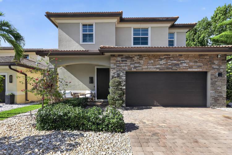 Welcome to this stunning 2 story residence in Stonewood Reserve Jupiter, FL.