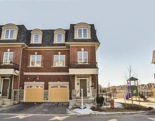 LARGE END UNIT TOWNHOUSE BACKING ON TO POND AND RAVINE.