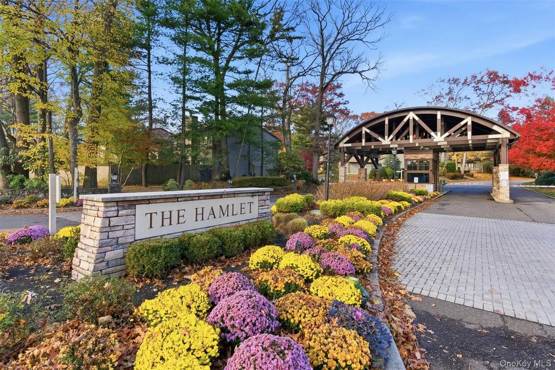 Surrounded by expansive greenery and a wrap around Trex deck, 234 Hamlet Drive is an end unit Ranch with three bedrooms and two and a half baths.