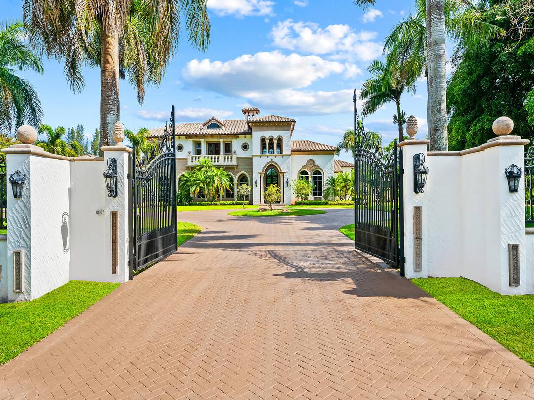 Palatial gated estate on 3 private acres of prime fenced property situated in the highly sought after BBB Ranches of Parkland, with 6' perimeter fence and electric gate.