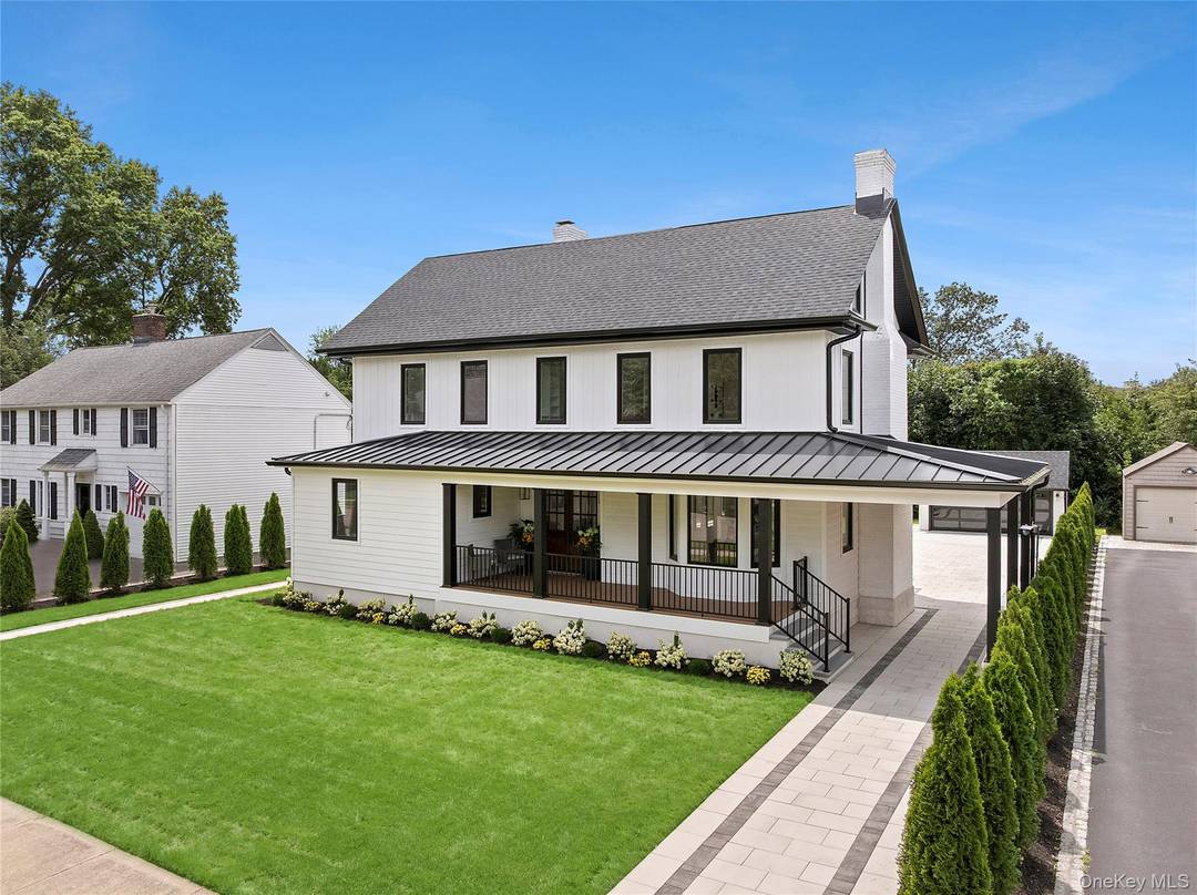 This magnificent six bedroom, four bathroom Garden City Colonial was completely rebuilt in 2024.