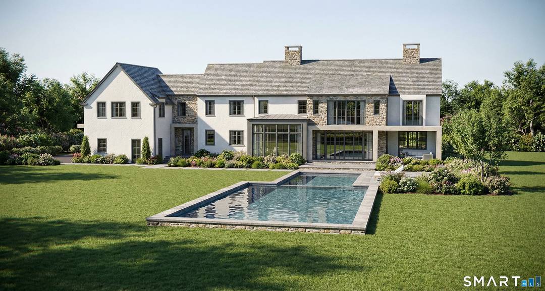 Set within artisan stone walls with curated flowering landscapes, this magnificent stone and stucco residence is a masterful tribute to Southport's enduring architectural legacy.