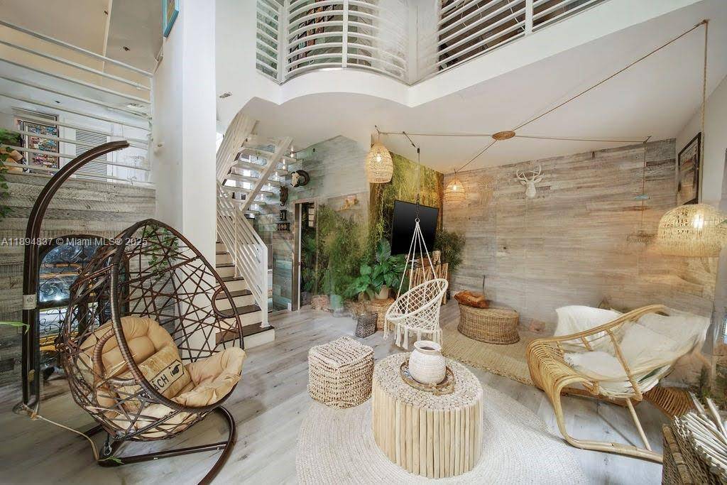 A RARE GEM THE JUNGLE TOWNHOUSE w PRIVATE 2 CAR GARAGE at The Courts in South Of Fifth, Miami s 1 neighborhood.