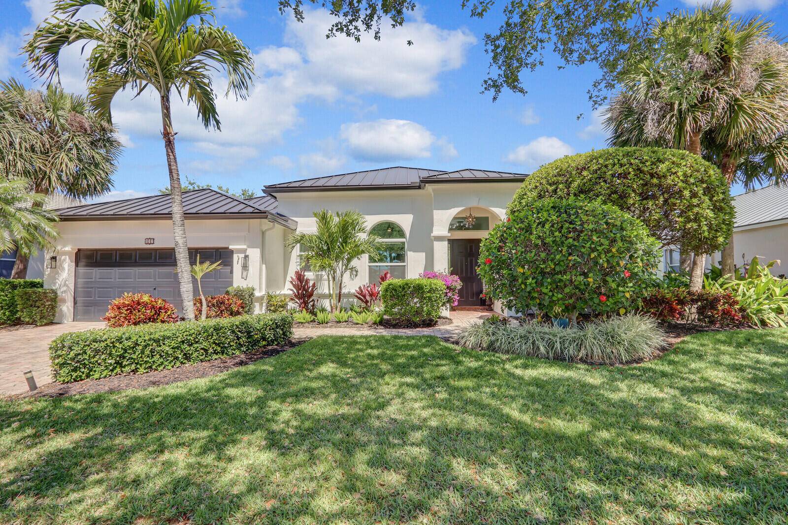 Welcome to paradise in this exquisitely renovated 3 bed, 3 bath home w flexible office den space, nestled in the heart of Tequesta's peaceful Riverside Oaks.