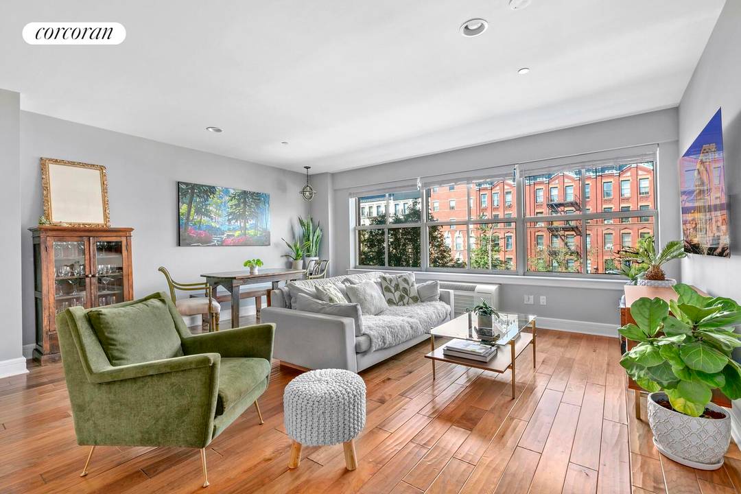 Enjoy the best of Harlem in this bright and spacious two bedroom, two bathroom home with magnificent views of historic brick townhouses and a tree lined boulevard.