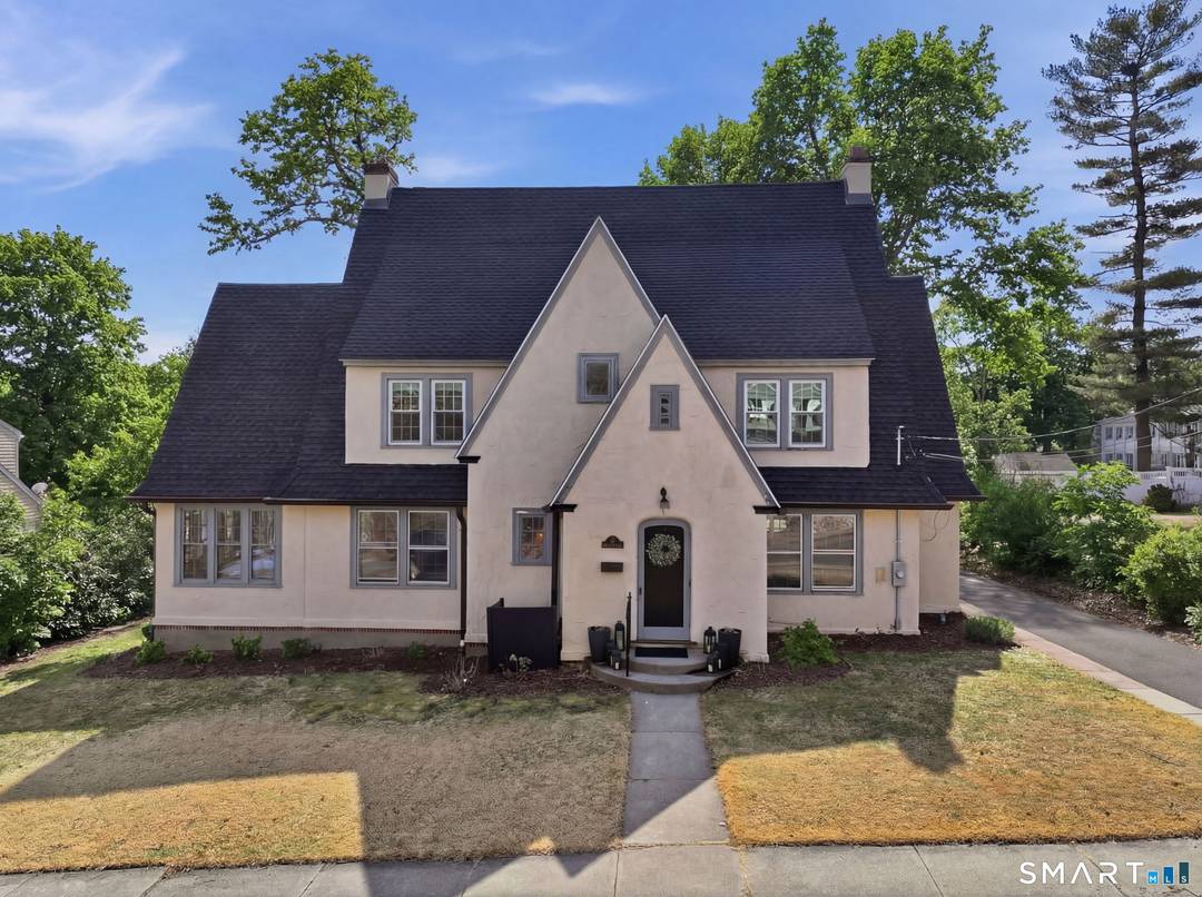 Classic architecture meets modern updates in this beautiful three story Tudor style stucco home ideally located just steps from Wesleyan University and within walking distance to vibrant downtown Middletown, where ...