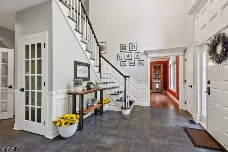 Fabulous custom built home with custom upgrades throughout kitchen 2014 with custom cherry cabinetry, including 2 built in pantries and 2 built in corner bookcases ; family room with custom ...