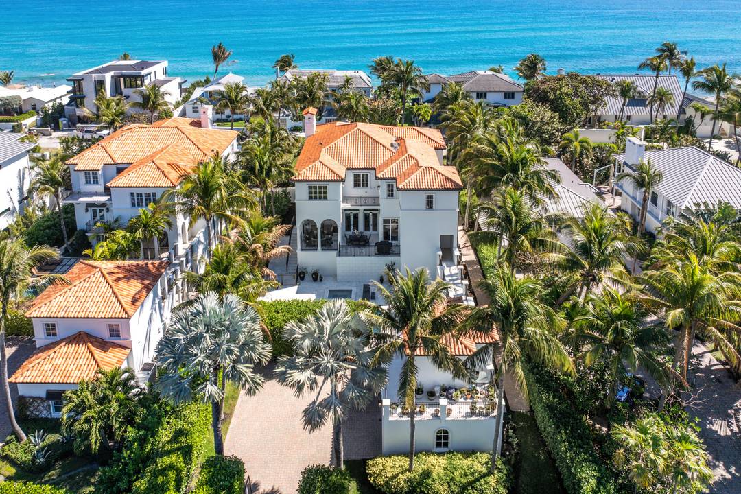 This Ocean Ridge estate embodies refined coastal living, offering easy access to a secluded beach just steps from the sand.