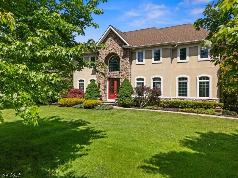 Attention to detail is evident at every turn, from the beautifully detailed millwork and recessed lighting throughout, to the leaded glass front doors and colonial grid windows.