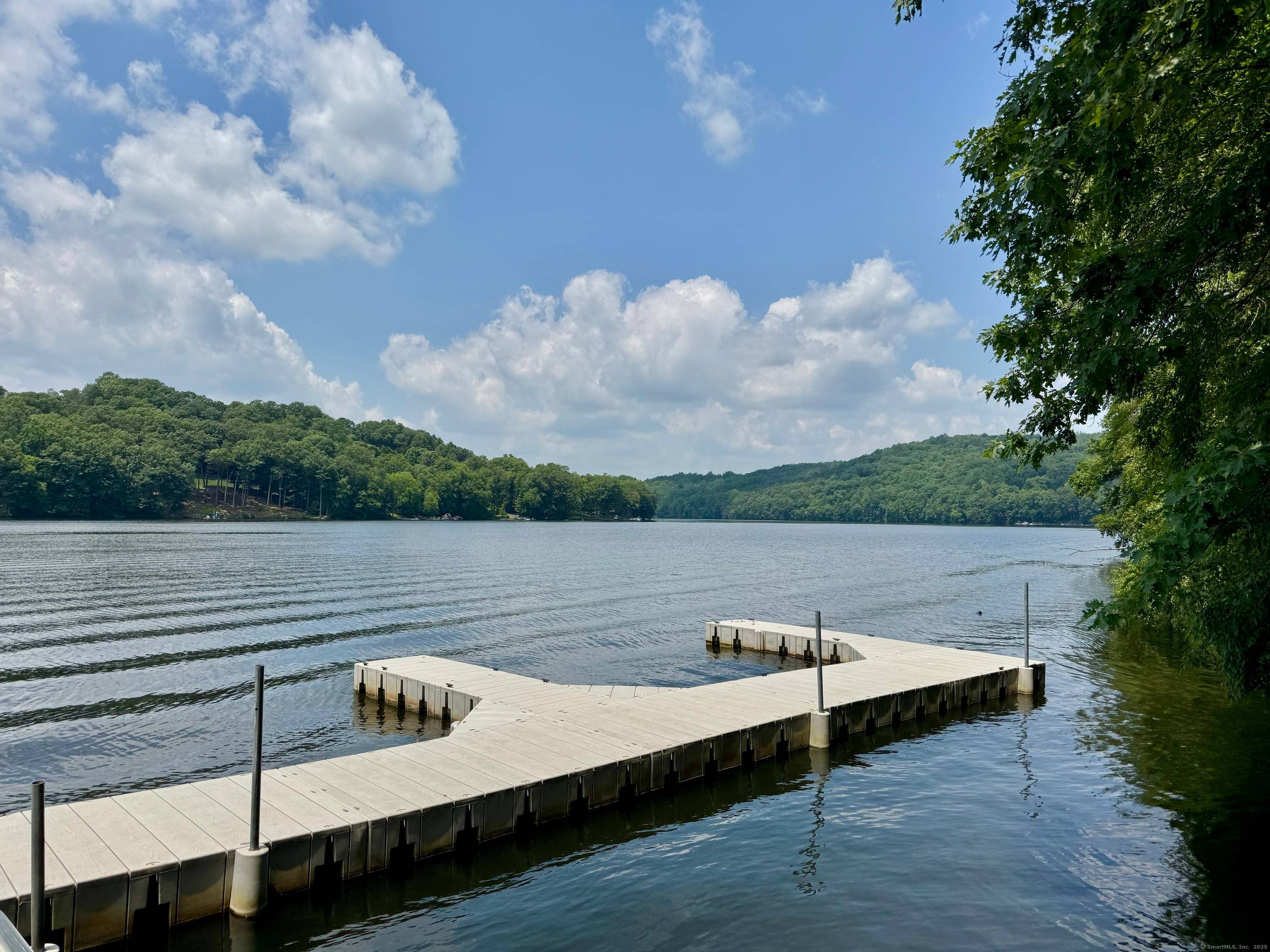 This spacious Colonial is perfectly set on 2 acres adjacent to a nature preserve with hiking trails.