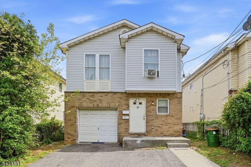 Welcome to this 2002 built 2 family home with great potential !