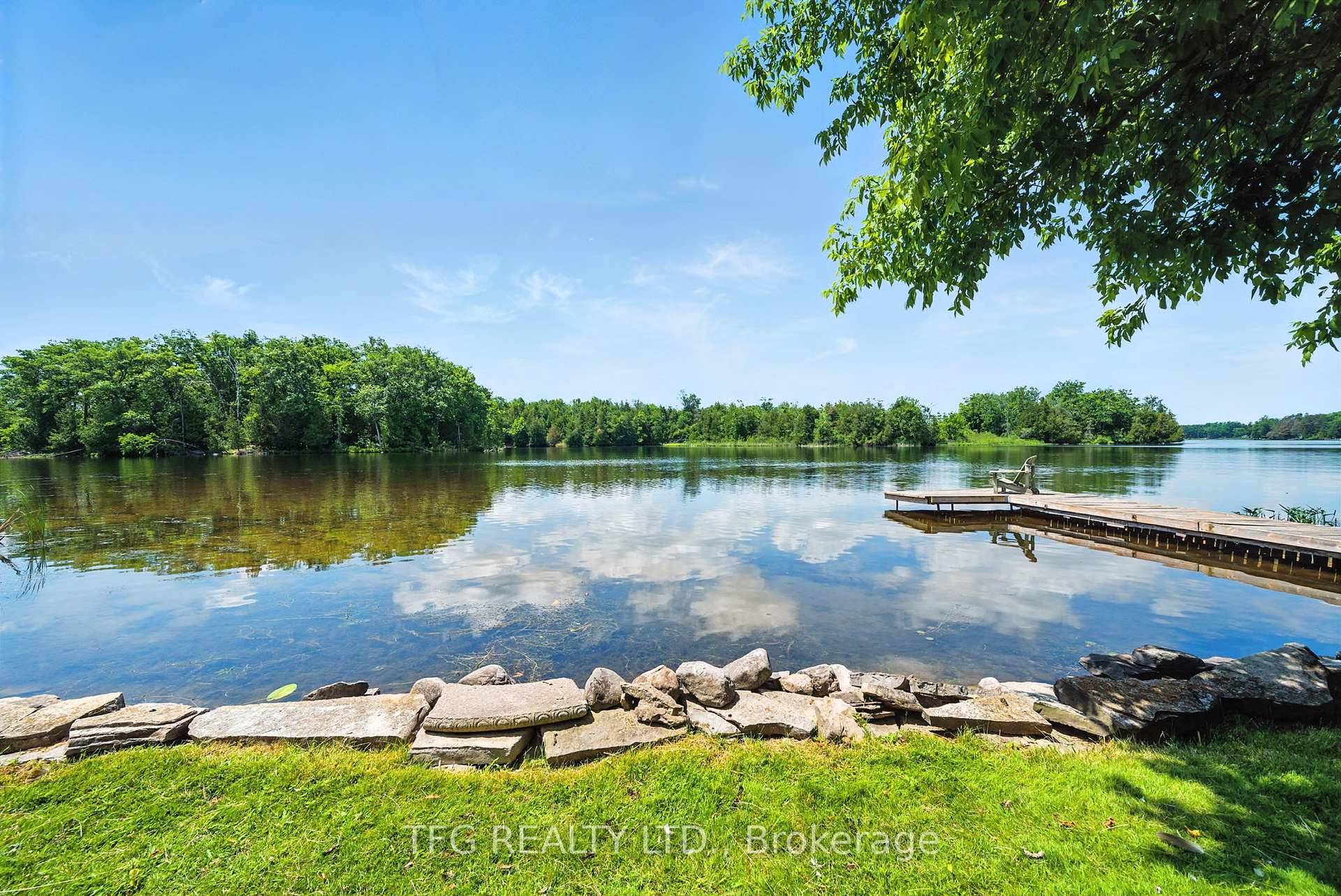 Waterfront oasis with western exposure on the beautiful Trent River with 70' of water frontage with dock and walk in shoreline.