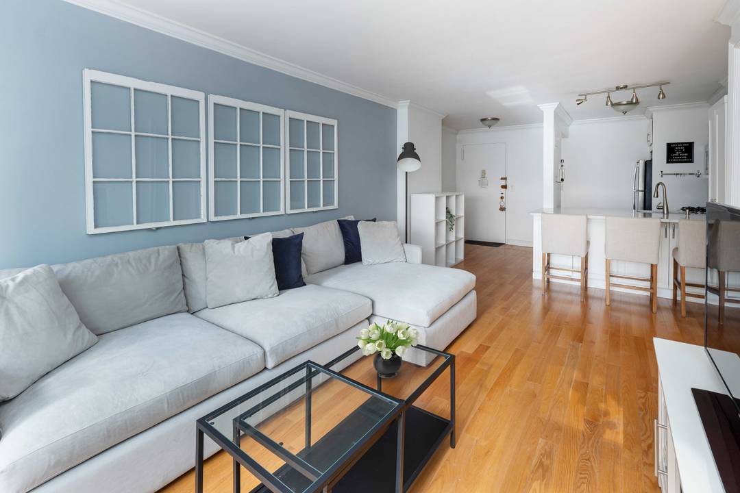 Experience refined city living in this beautifully renovated south facing home at the Gotham Town House.