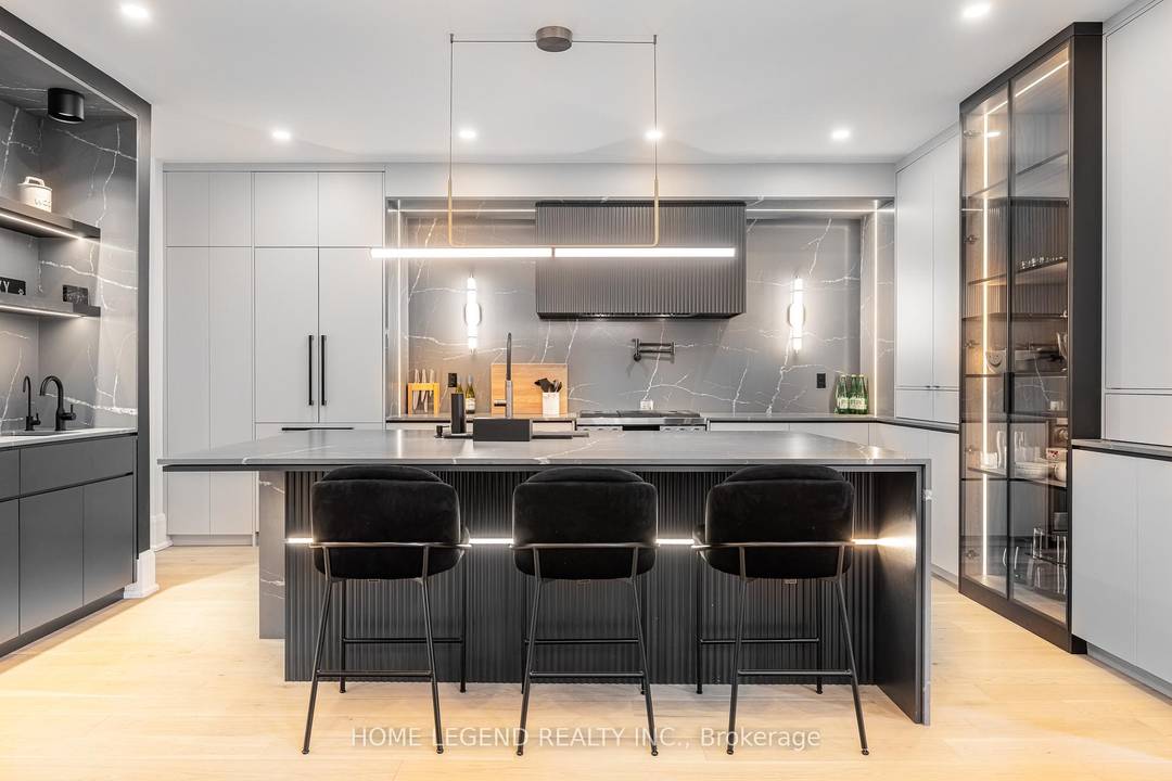 Professionally designed with exceptional attention to detail, this stunning turnkey residence showcases luxurious finishes and premium upgrades throughout.