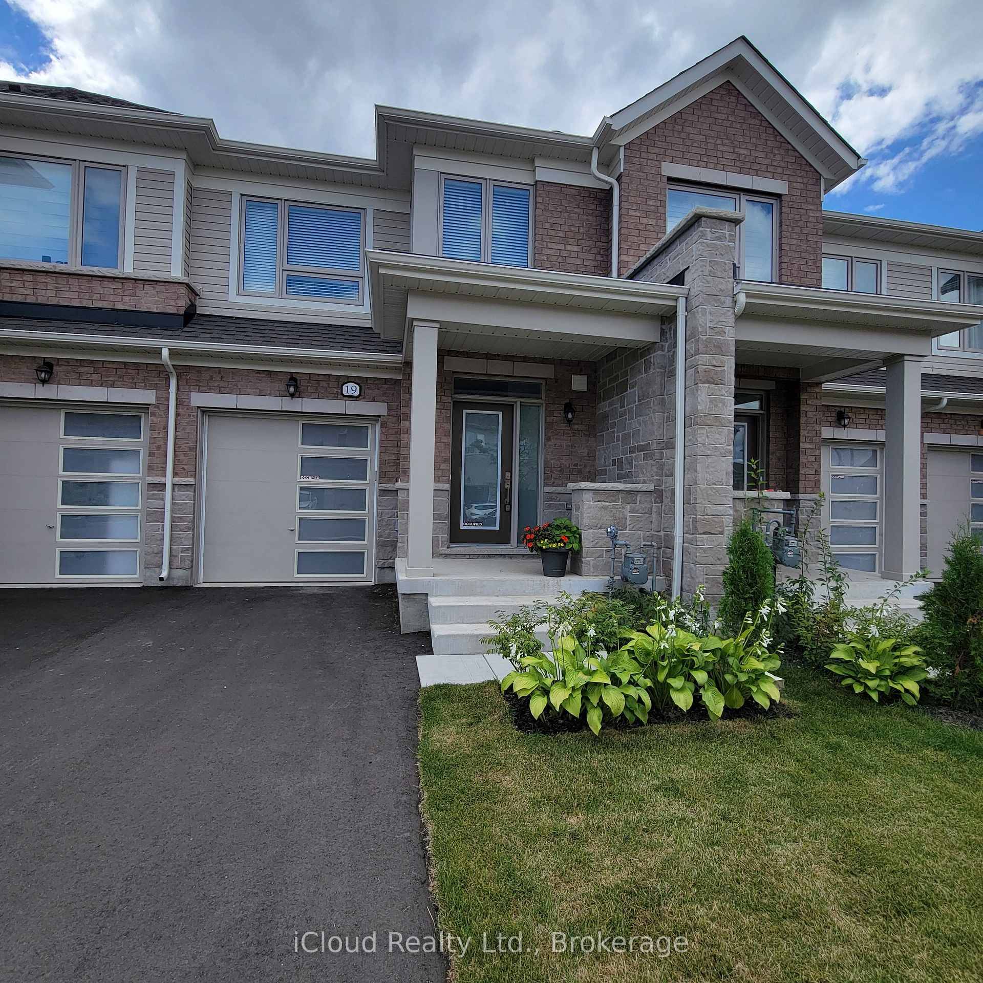 Welcome to this Modern Brick and Stone Elevation B Premium townhouse in Fergus's new Storybrook subdivision.