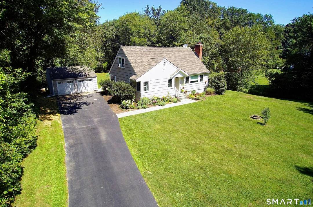 Idyllic country cape on picture perfect level lot, set back privately with fenced in backyard, new spacious deck for entertaining, plus built in wading pool for summer fun.