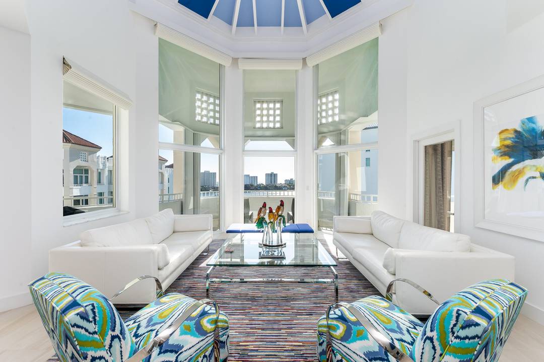 Enjoy the East Ocean, West Sunset views of this Mizner TOWER PENTHOUSE with soaring 22 foot ceilings, an exceptional blend of luxury, privacy, and the coveted waterfront lifestyle on the ...