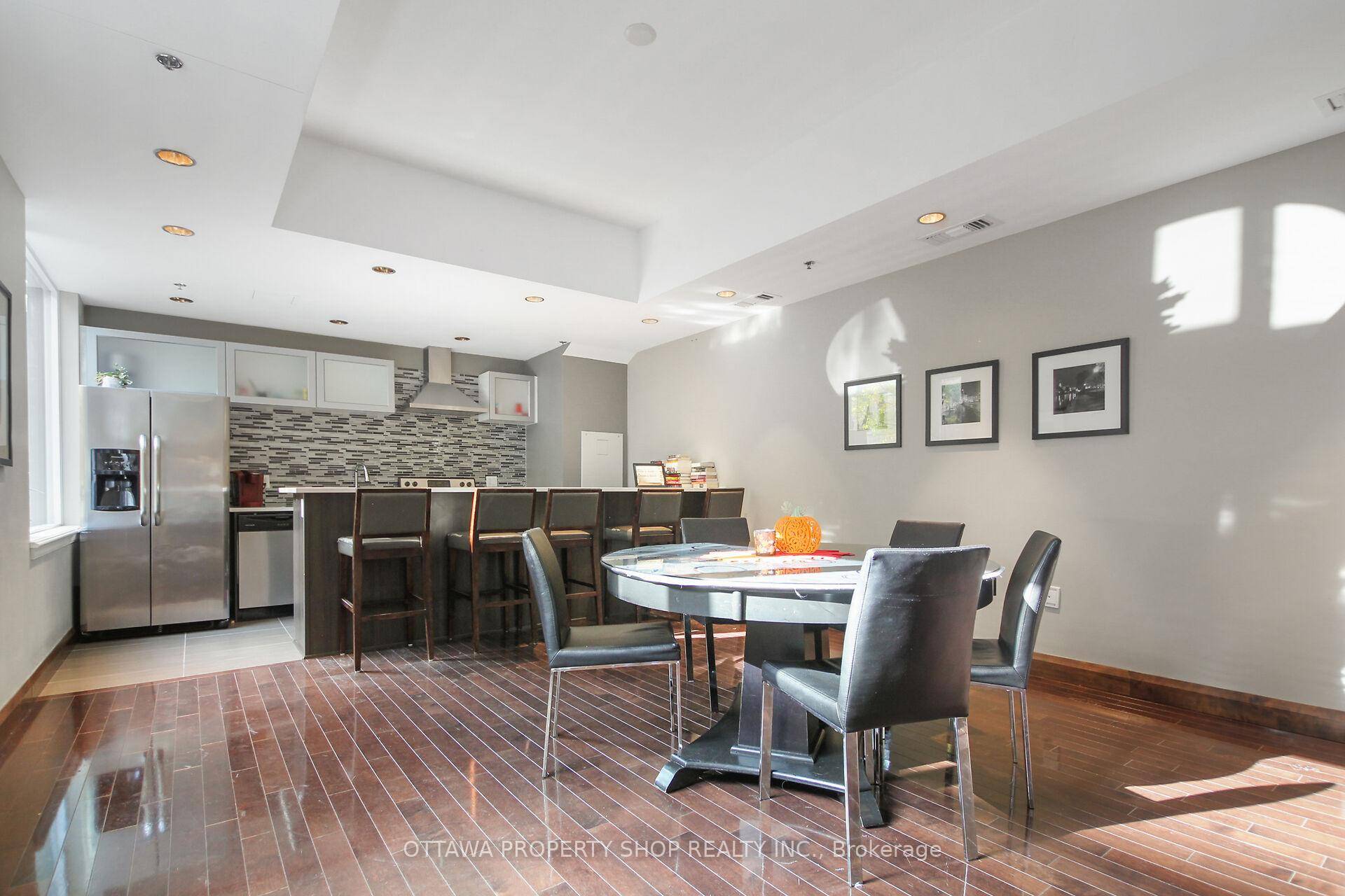 Picture a stunning open concept condo flooded with natural light pouring in through expansive windows.