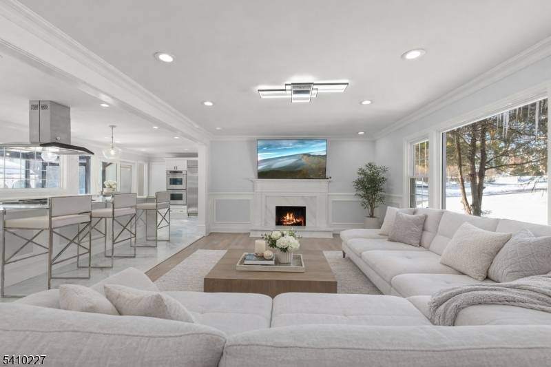 Move right into this beautifully renovated 4 bedroom, 3 bath custom home set on an expansive, park like property in the sought after Deerfield section of Short Hills.