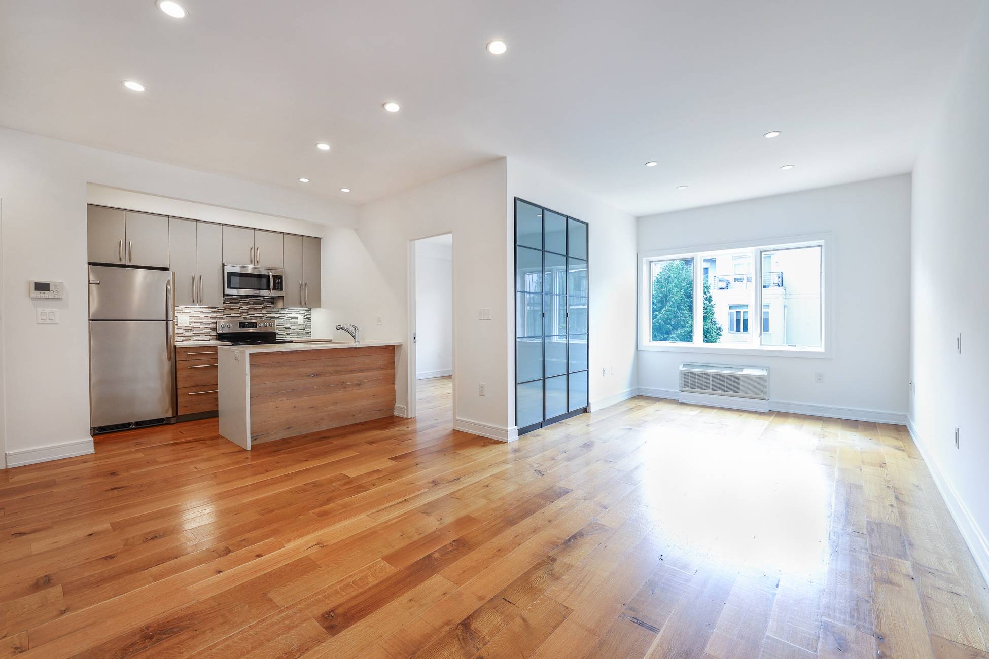This large 1 bedroom home is perched on the 3rd floor of the petite building, facing the rear.