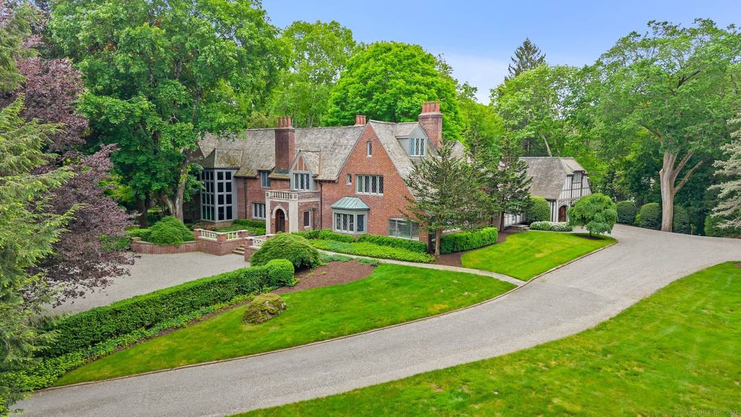 Historic charm meets modern luxury on 5 private acres in lower Weston.
