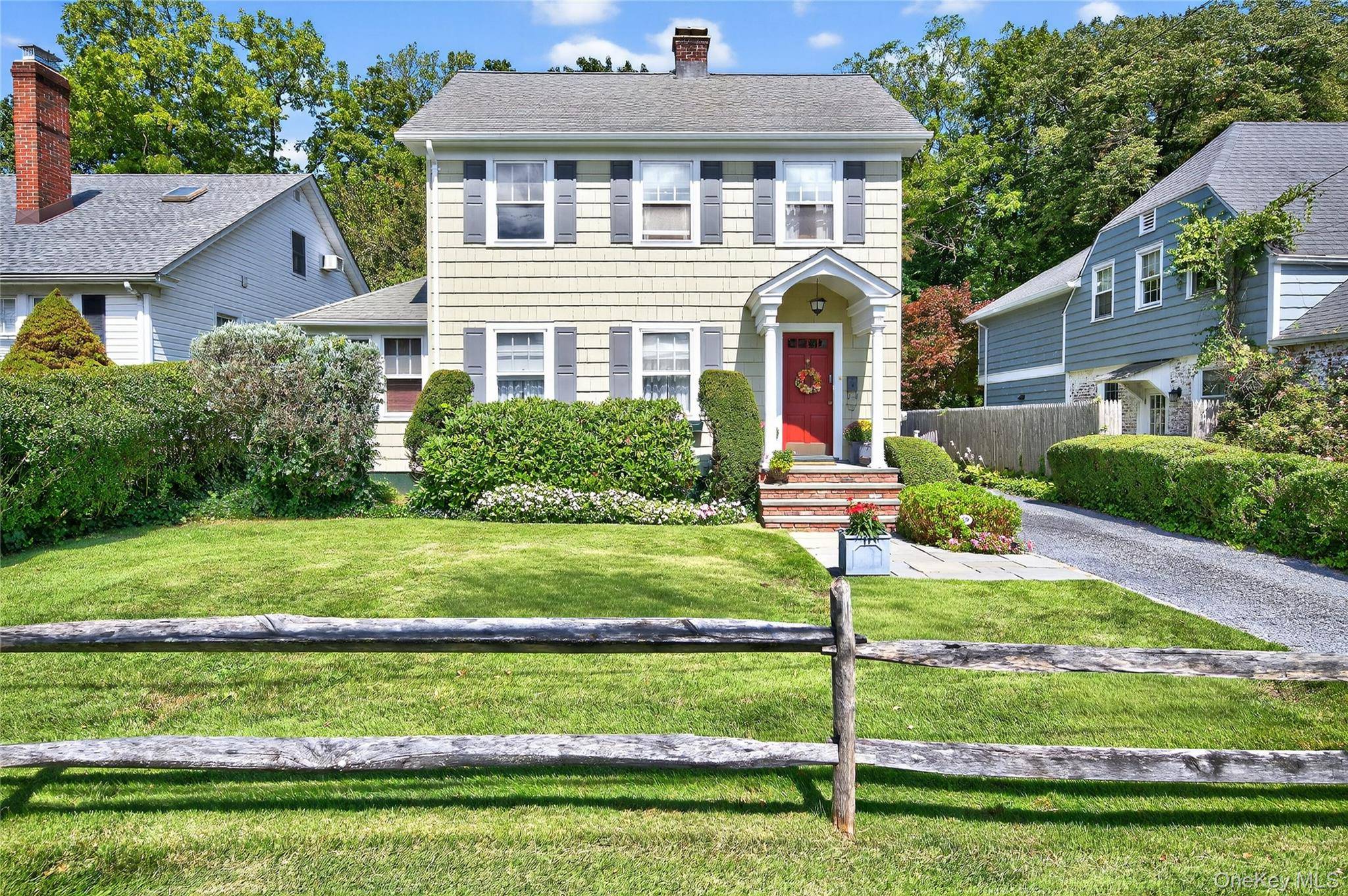 Nestled in the coveted hamlet of Locust Valley, this 3 bedroom, 1.
