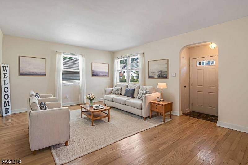 This classic brick faced cape cod in a prime Teaneck location offers a versatile layout with hardwood floors and timeless details throughout.