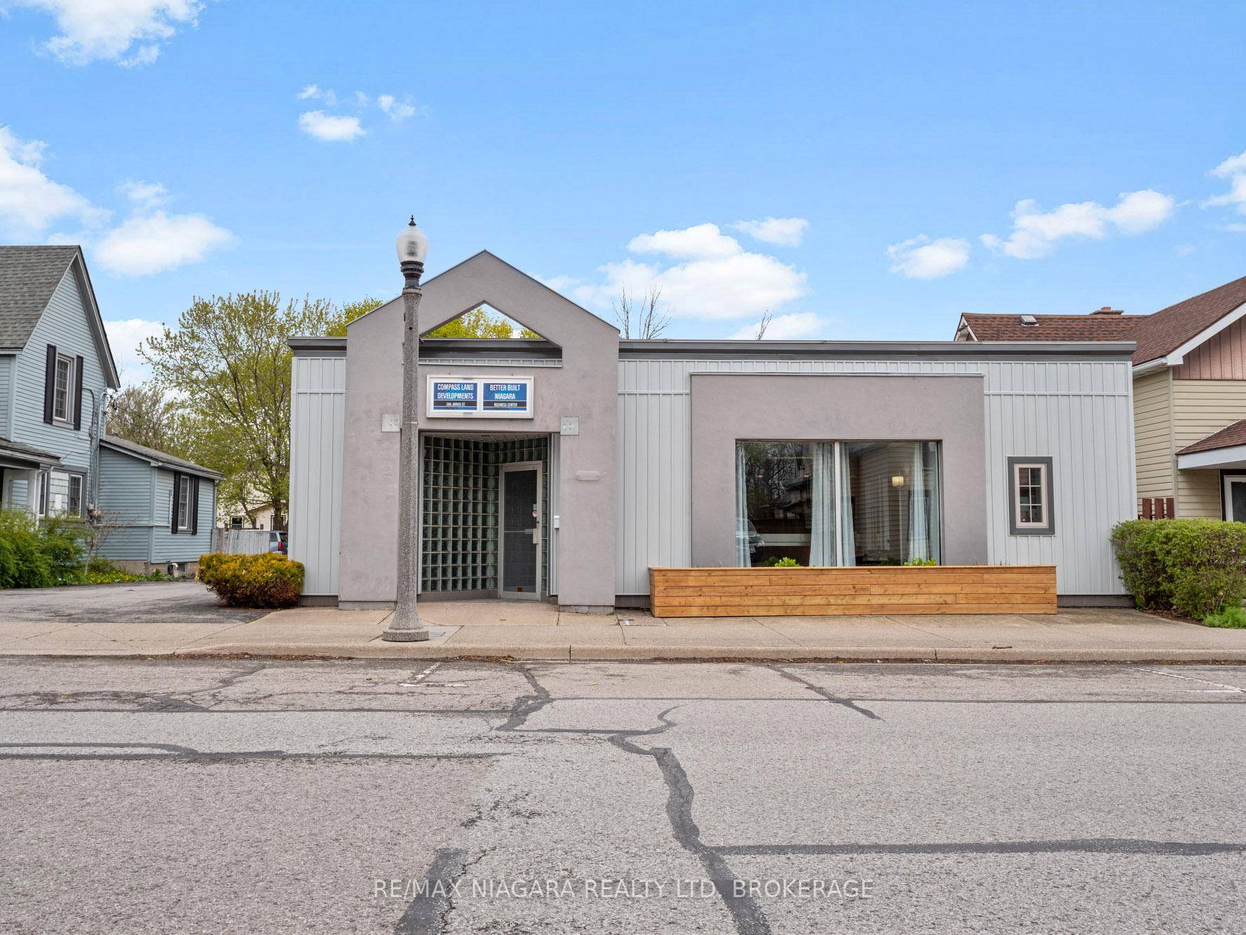 Beautiful office building with separate living quarters Front portion of the building has a large reception waiting room.