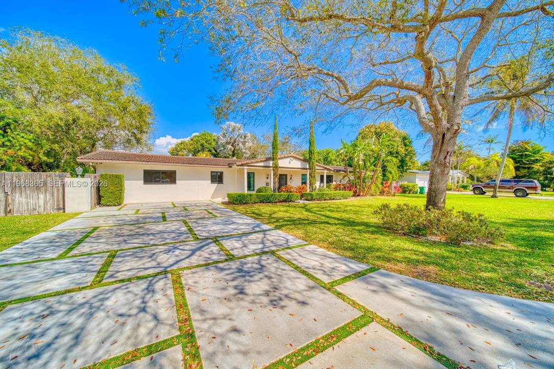 Tucked beneath majestic oak trees and filled with natural light, this beautifully renovated home offers exceptional indoor outdoor living in a highly desirable neighborhood close to Coral Reef Park, and ...