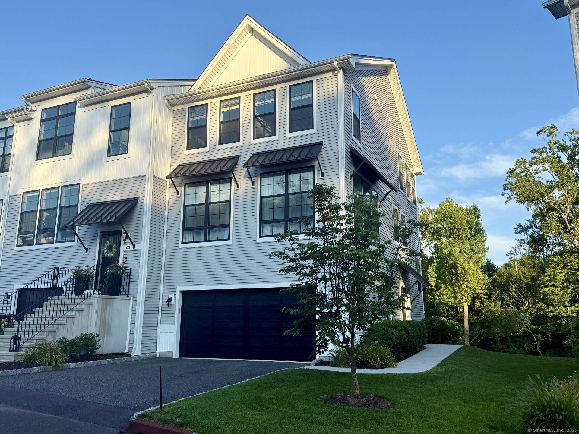 Exceptional 4BR, 3. 5BA end unit Toll Brothers townhome with 125K in upgrades in sought after Rivington.