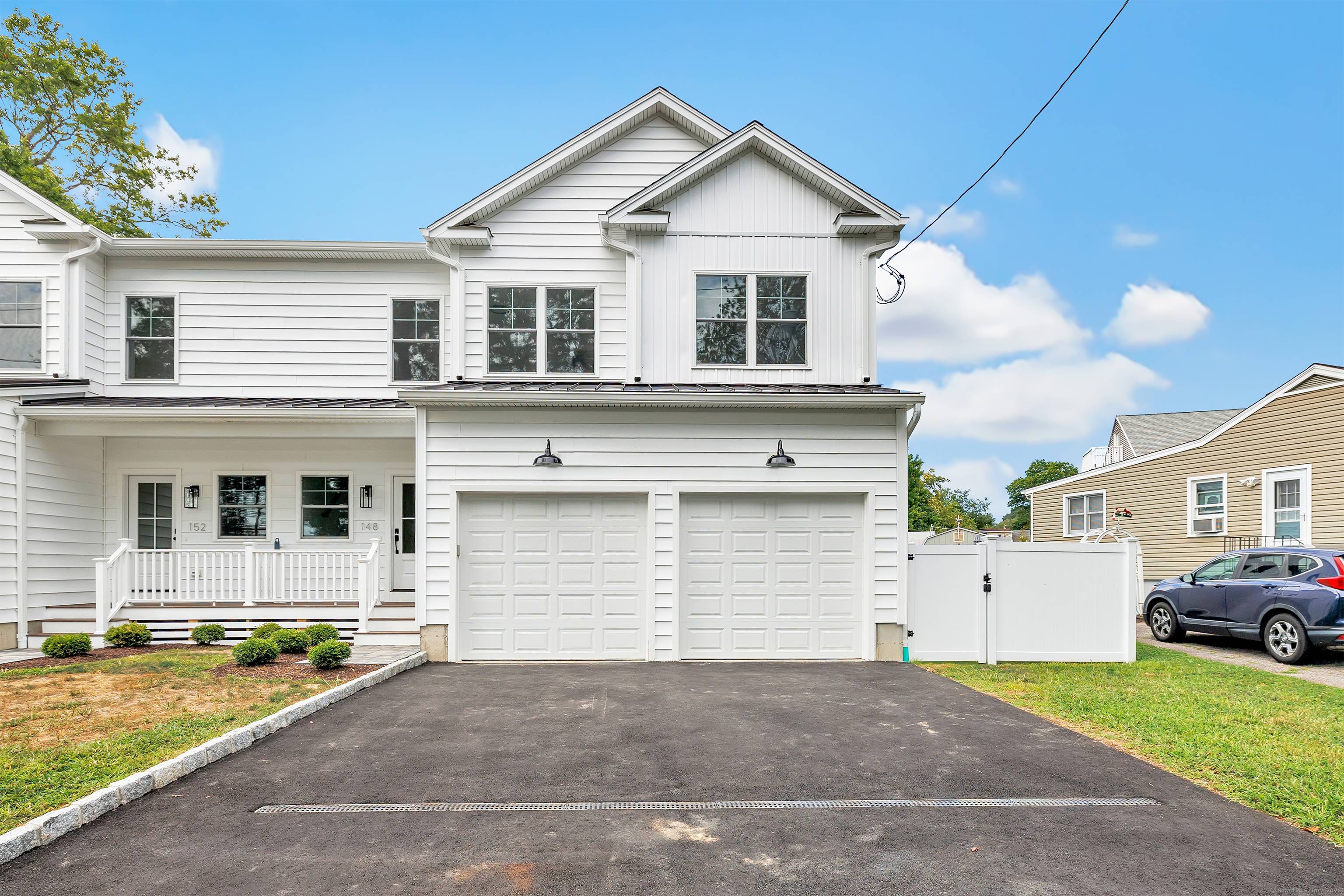 Welcome to this stunning, newly constructed duplex style residence where contemporary design and thoughtful details create a truly elevated living experience.